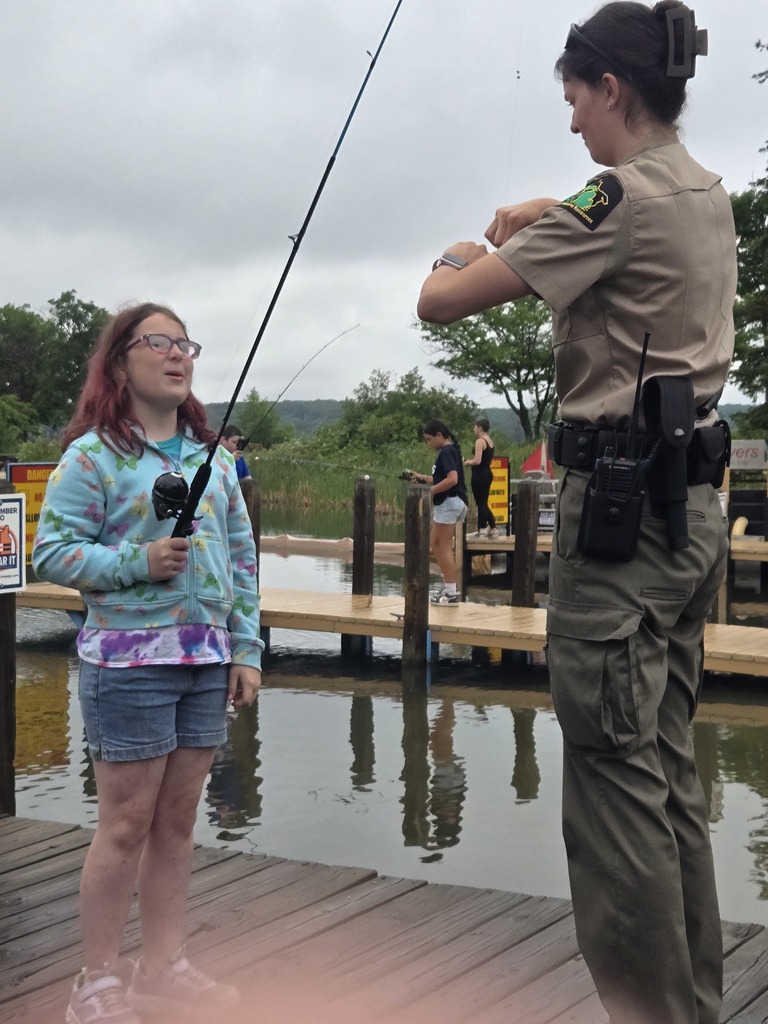 Telling tall tails and show off her catch.