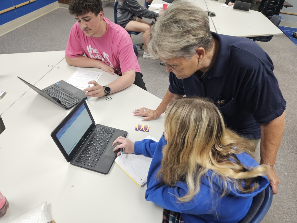 Mrs. Haley helping Isabella with her English Class. Isabella already finished half a year of English!
