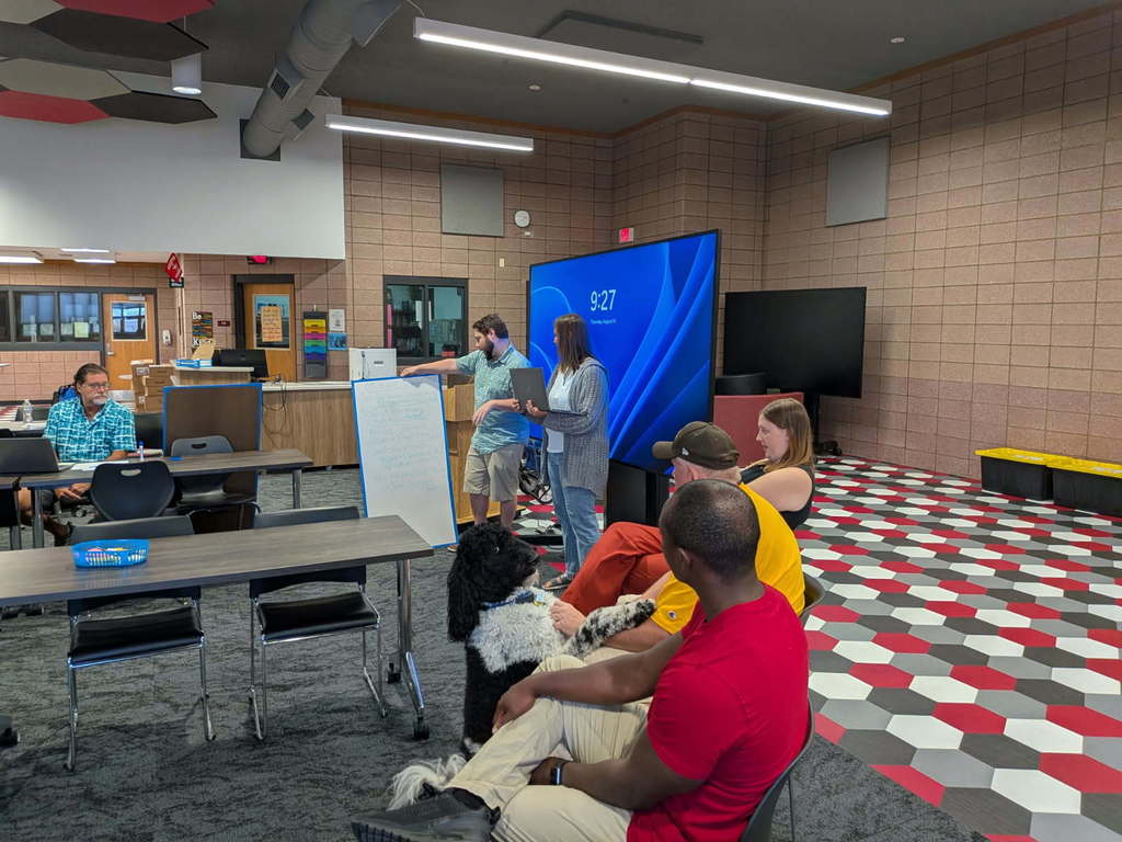 Teachers share the results of their research with their peers.