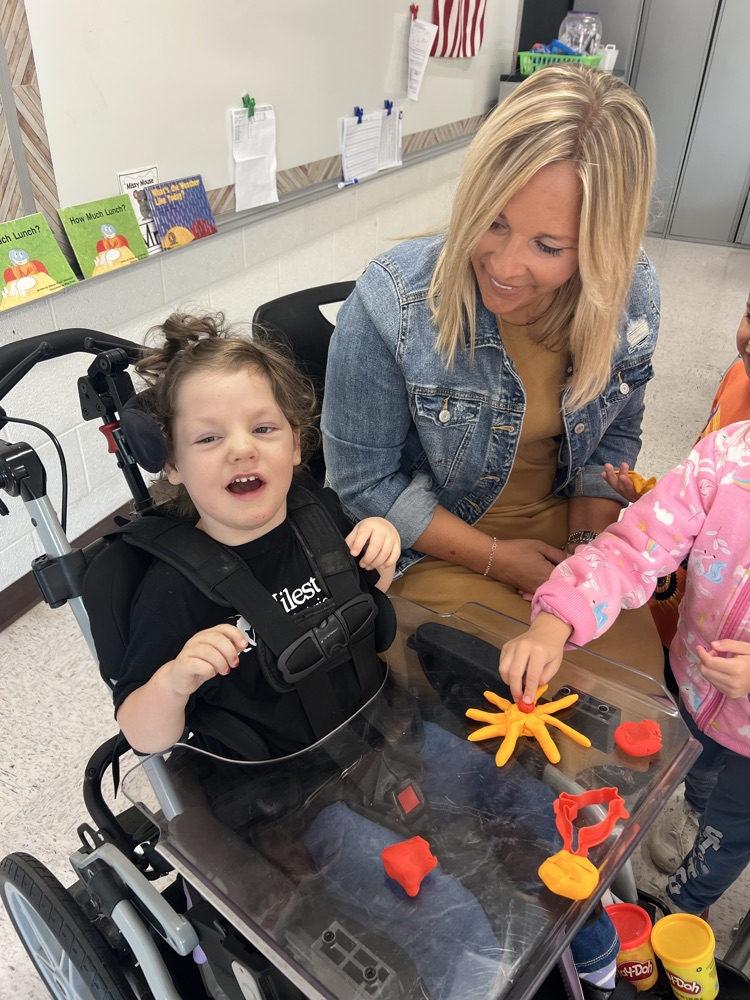 A student and and Occupational Therapist join a young 5s classroom