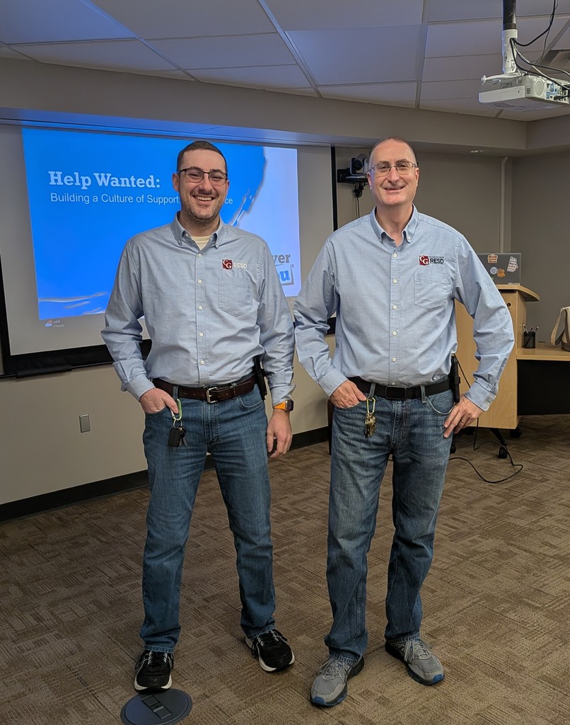 Ken Chinavare standing by a mirror.