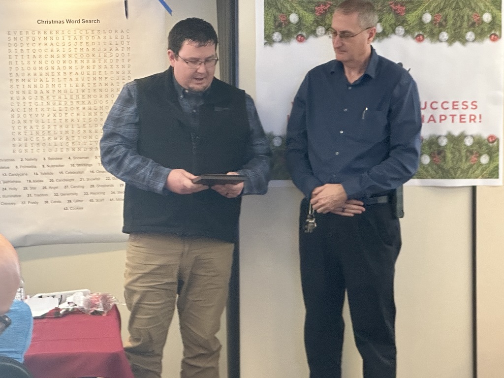 Ken Chinavare receiving plaque