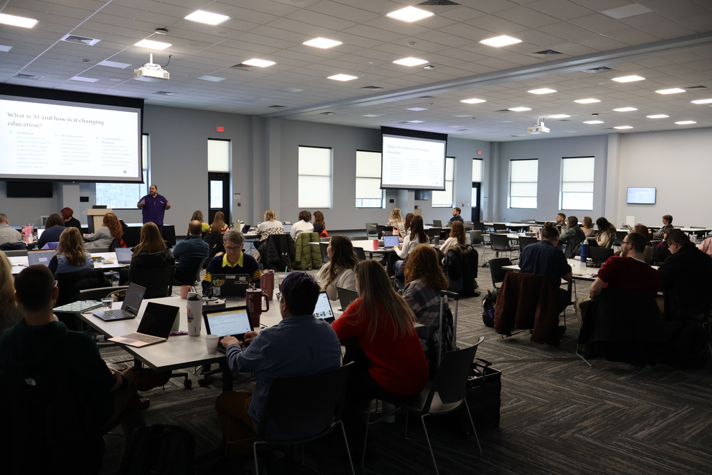 Staff attend a session on AI in schools.