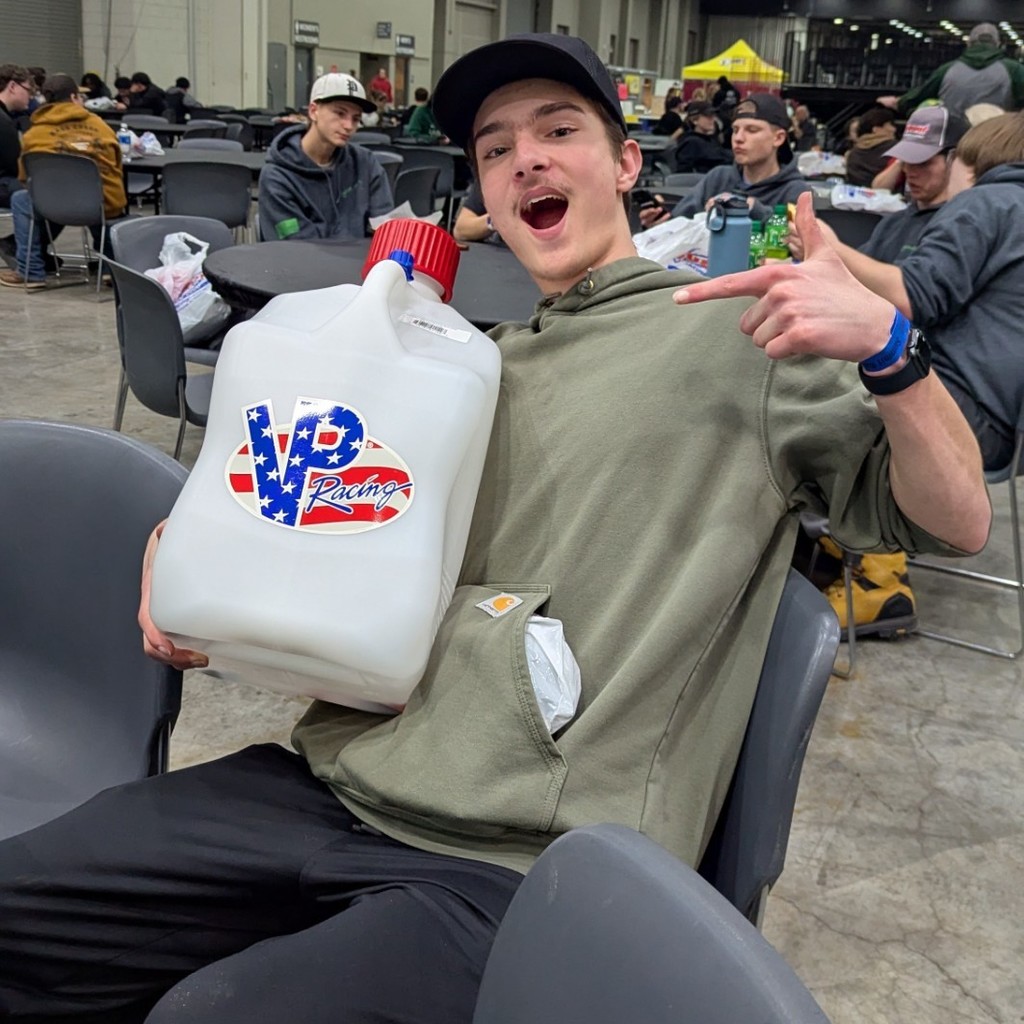 A student enjoys a souvenir from Autorama