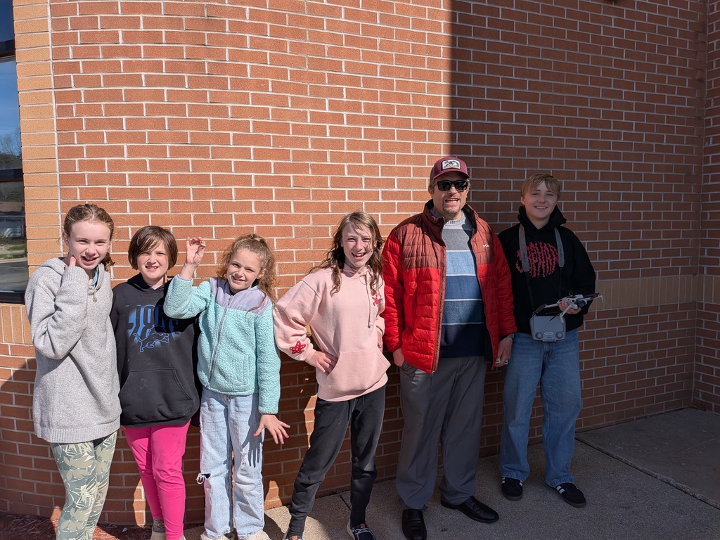 Farwell students with Mr. Winkler and a drone operator from the Clare HS drone club.