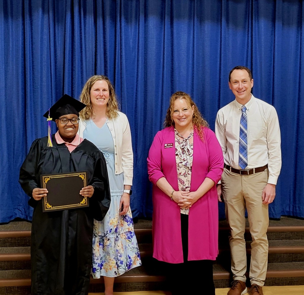 Getting her graduation certificate with Mike Simon, Superintendent, Katie Knapp-Wyman, Director of Special Education & Board member.