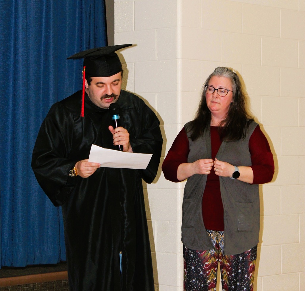 Giving his speech at graduation with something fun for who is #1