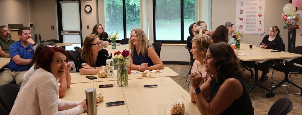 Participants laugh  at  one of Stacey's classic jokes.