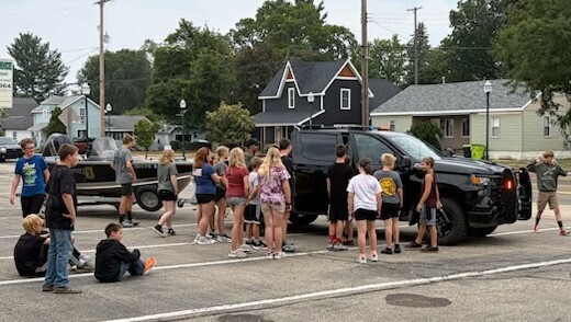 A hands-on look inside a police vehicle during the Youth Police Academy.