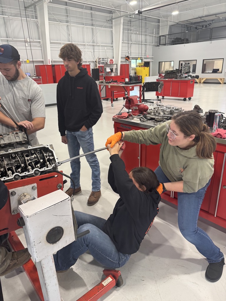 Ladies learning a lesson in applying torque.