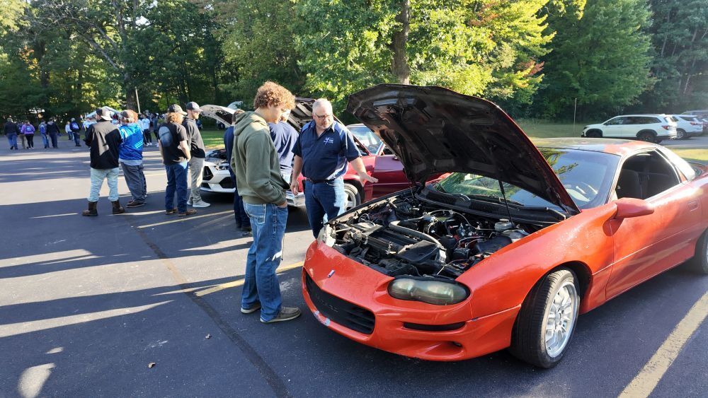 Senior Focus Day - Student looking at car