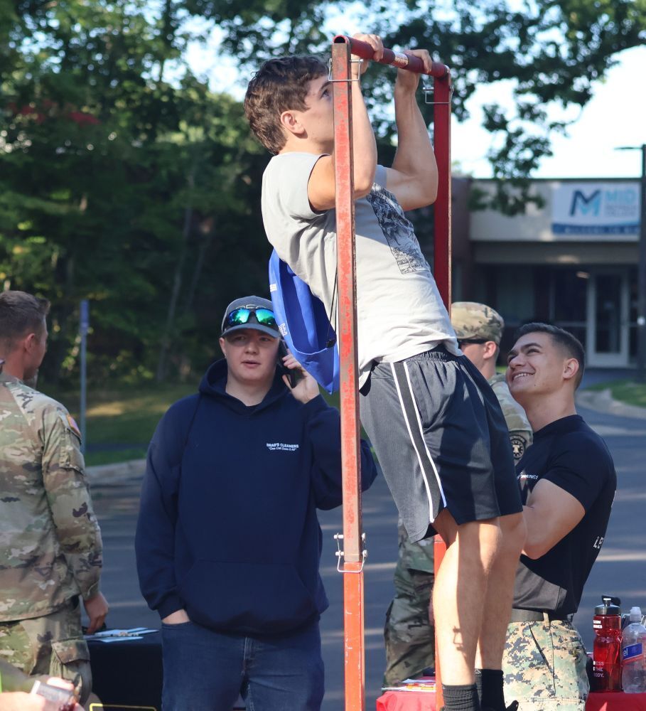 Student trying his had at pull-ups  at Senior Focus Day.