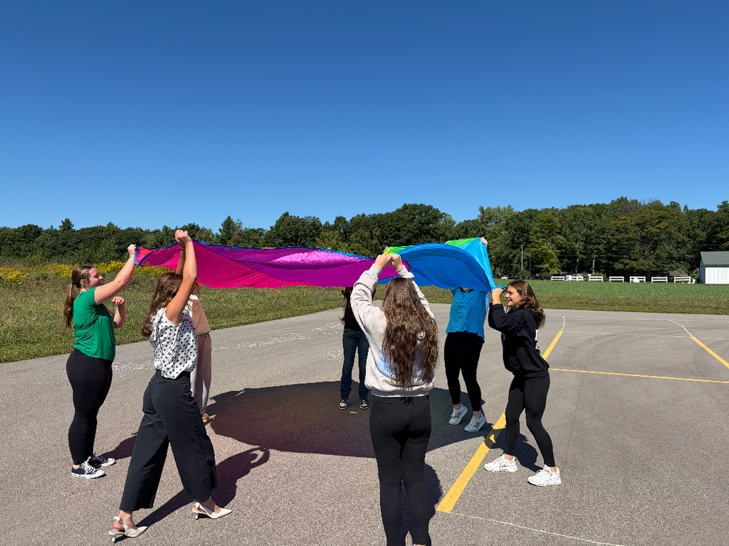 Students having a parachute activity.