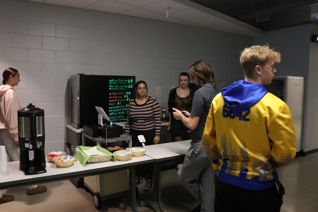 Culinary cafe students purchasing items.
