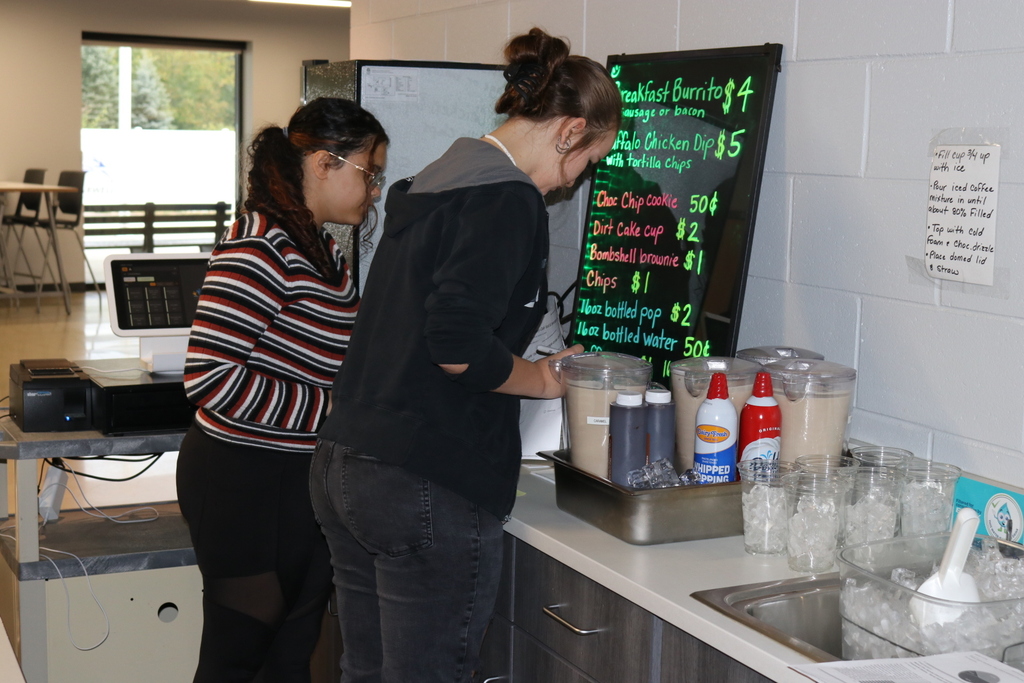 Culinary cafe workers making speciality drinks
