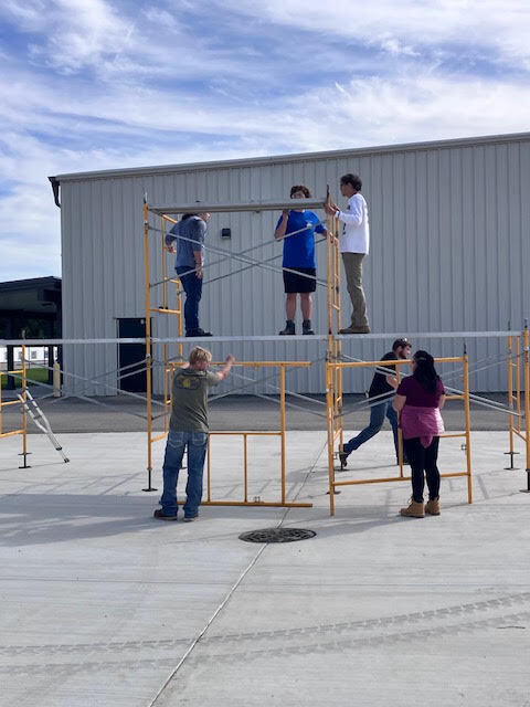 Construction Trades students setting up scaffolding.