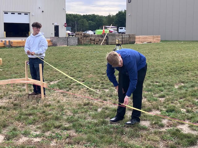 Construction Trades students setting strings.