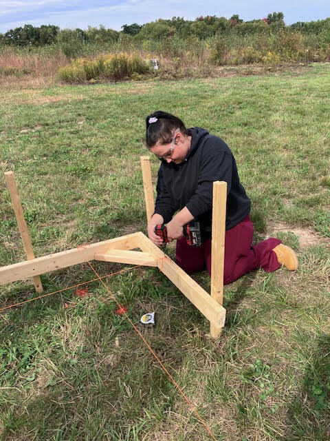 Construction Trades student setting strings.