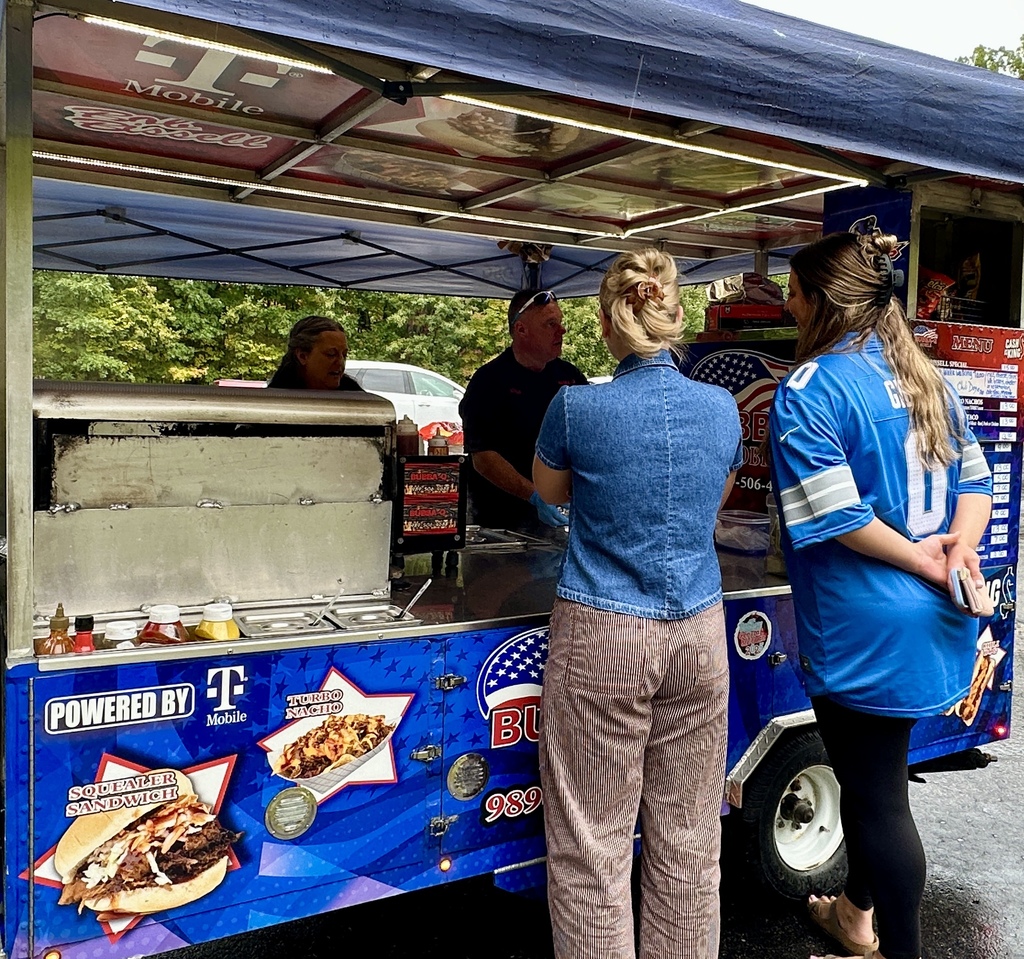 Employees ordering lunch from Bubba-Q's Food Cart.