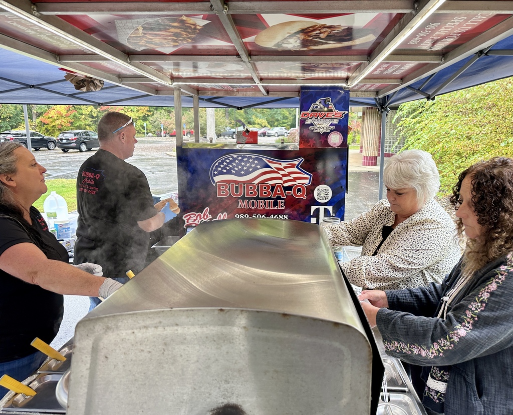 Employees ordering lunch from Bubba-Q's Food Cart.