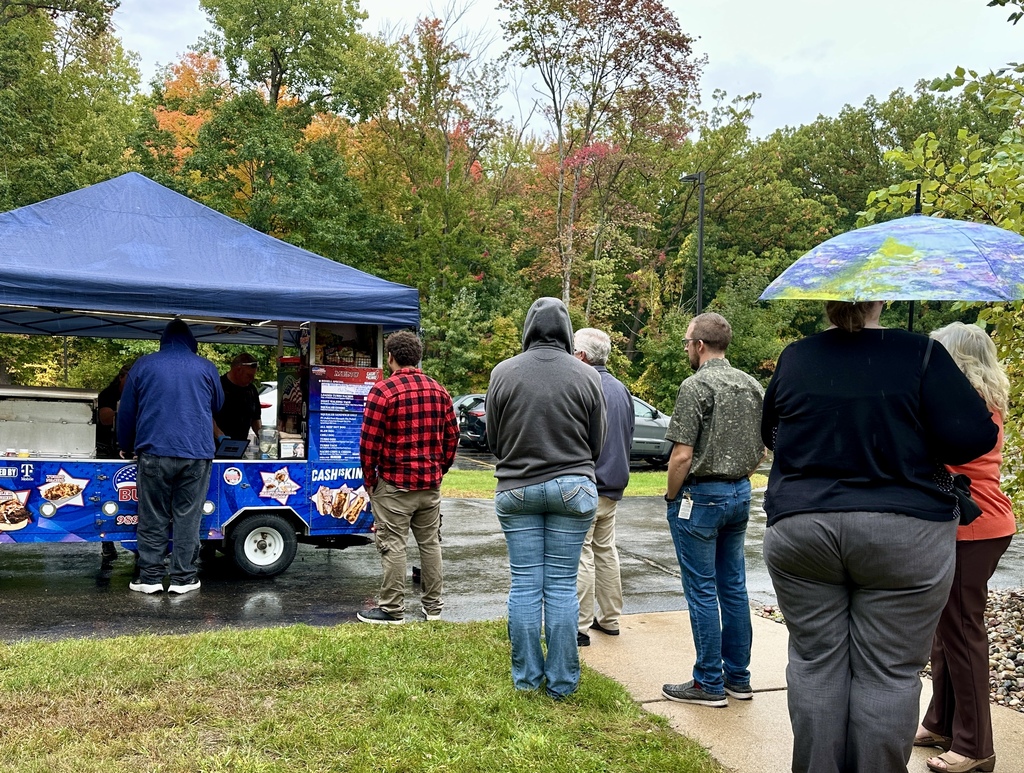 Employees ordering lunch from Bubba-Q's Food Cart.