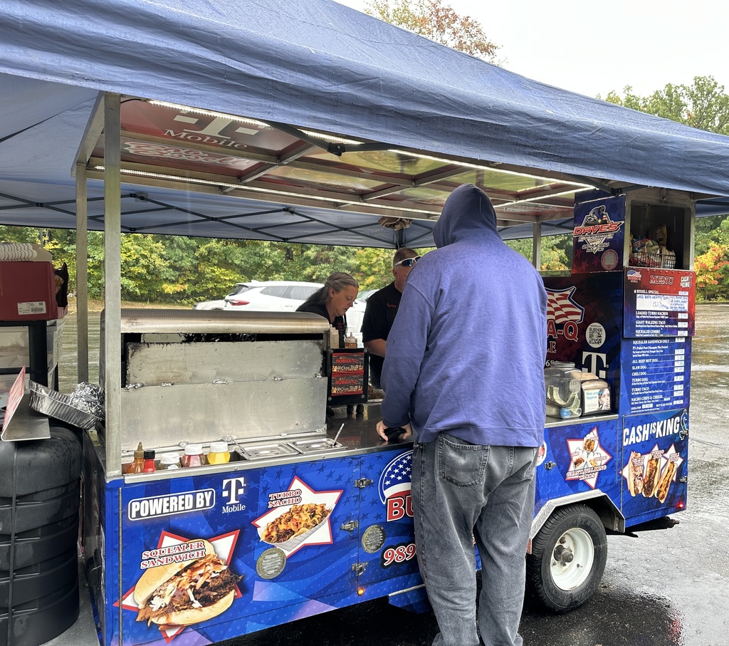 Employees ordering lunch from Bubba-Q's Food Cart.