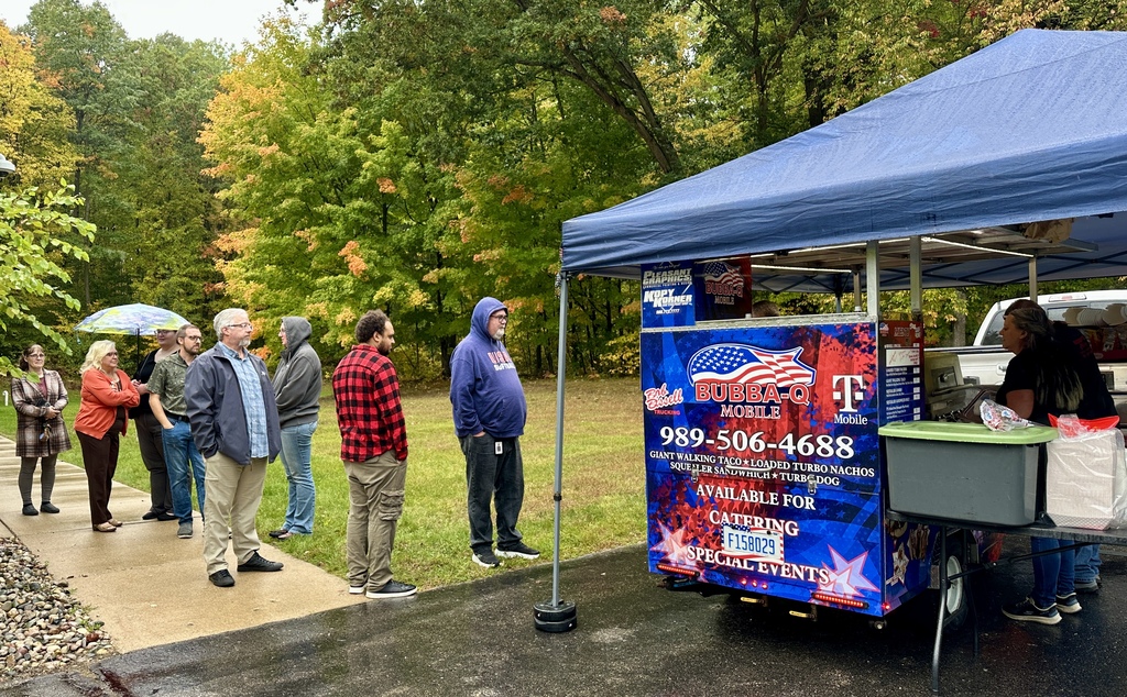 Employees ordering lunch from Bubba-Q's Food Cart.