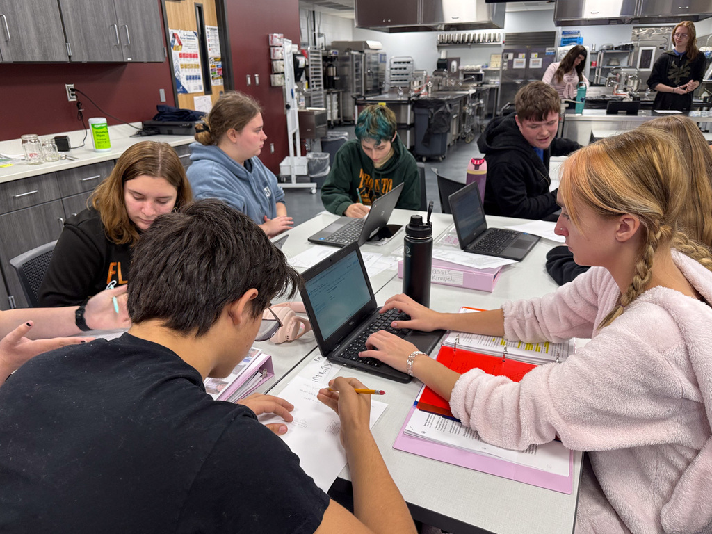 Students working a project together