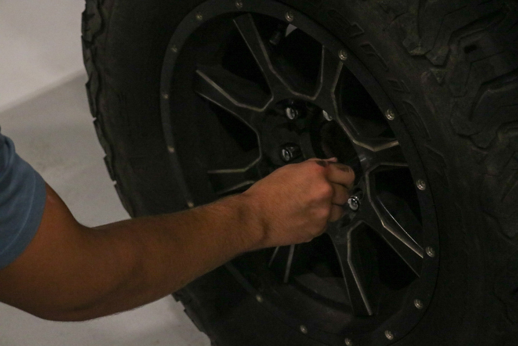 Student screwing on wheel