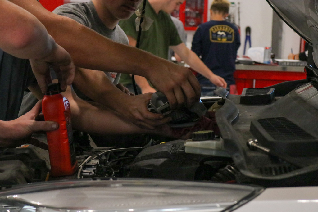 Students topping off fluids