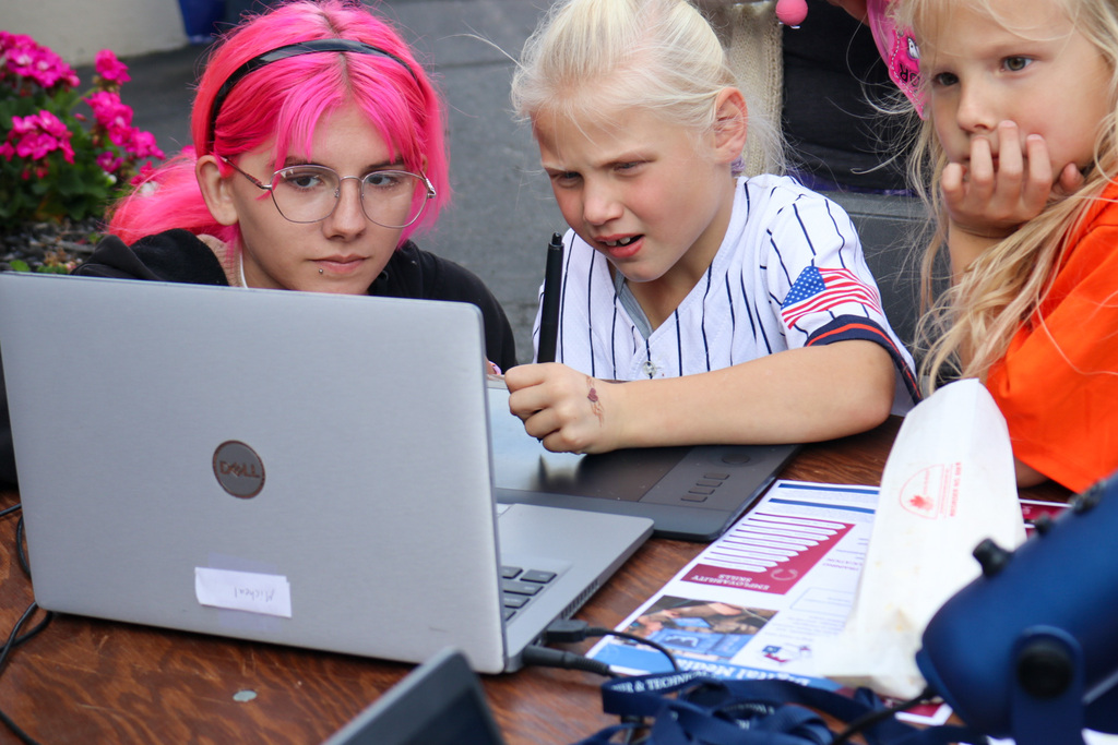 Student helping kids animate