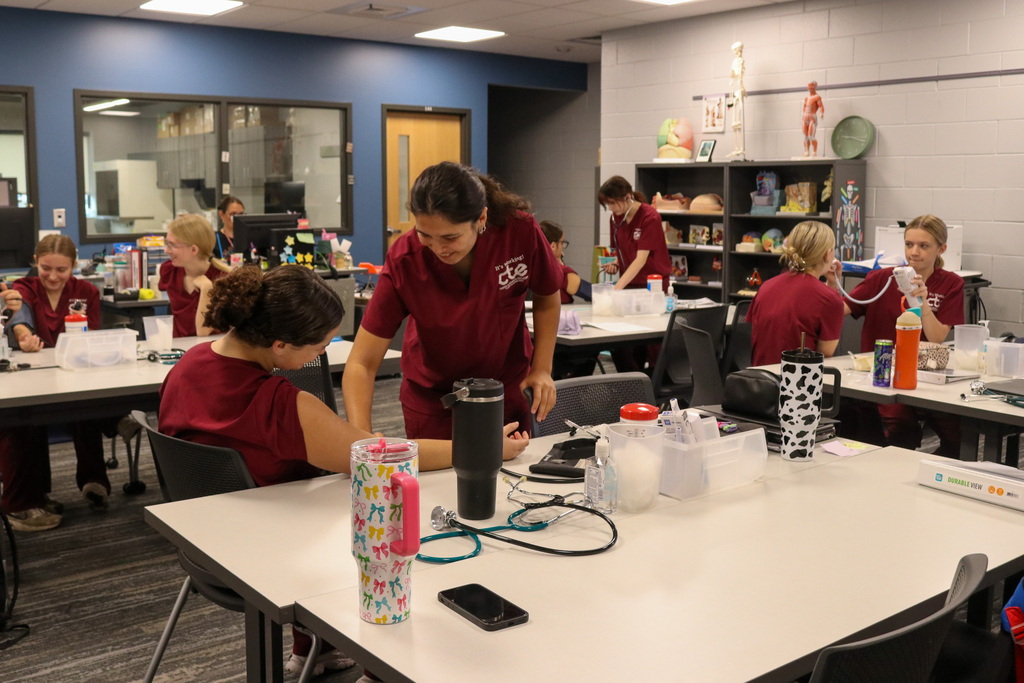 Students learning how to take vitals