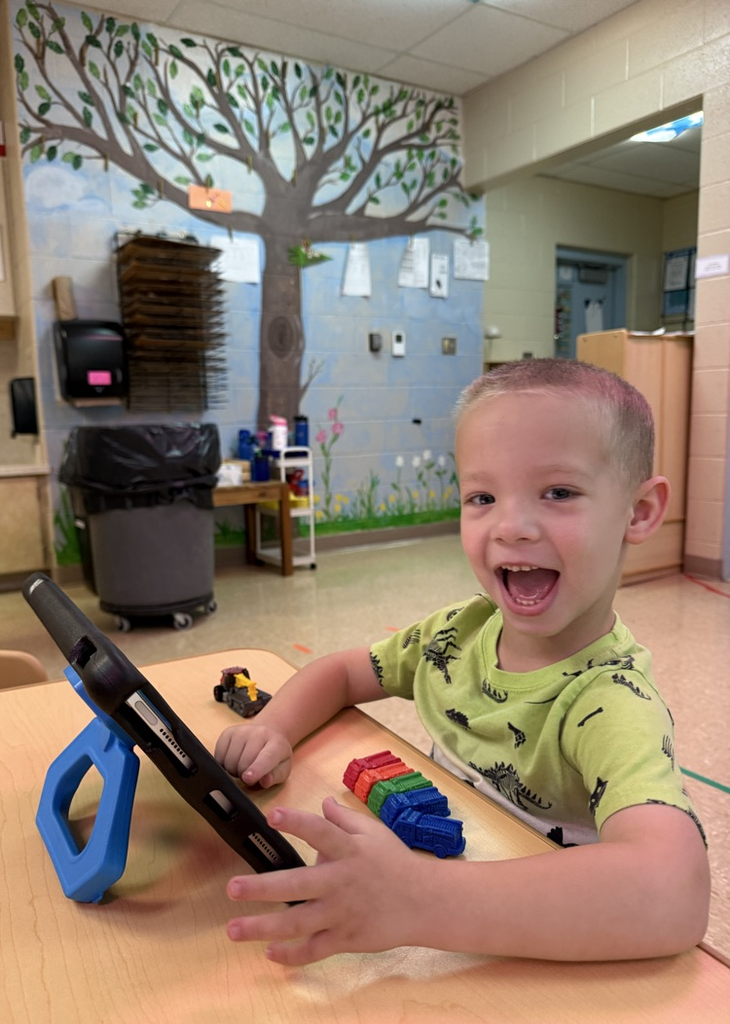 child using aac device  