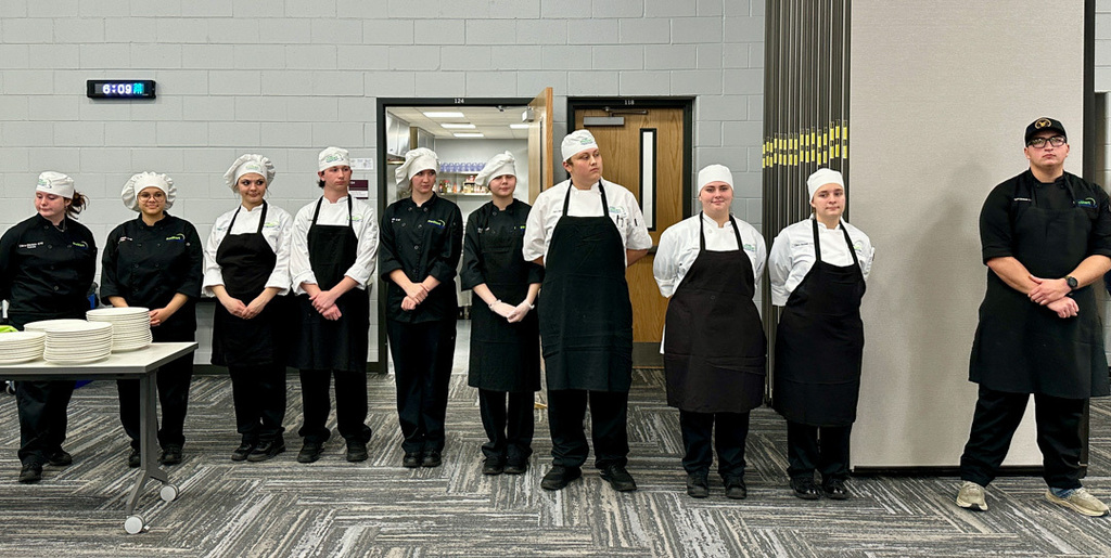 Culinary Arts students standing in a line