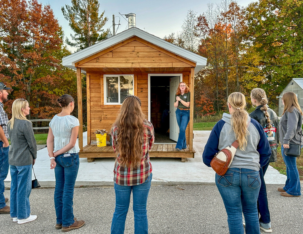 Agricultural Science advisory meeting around a shed