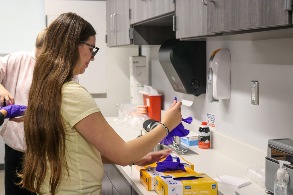 10th grader doing a demo for a Health Occupations 