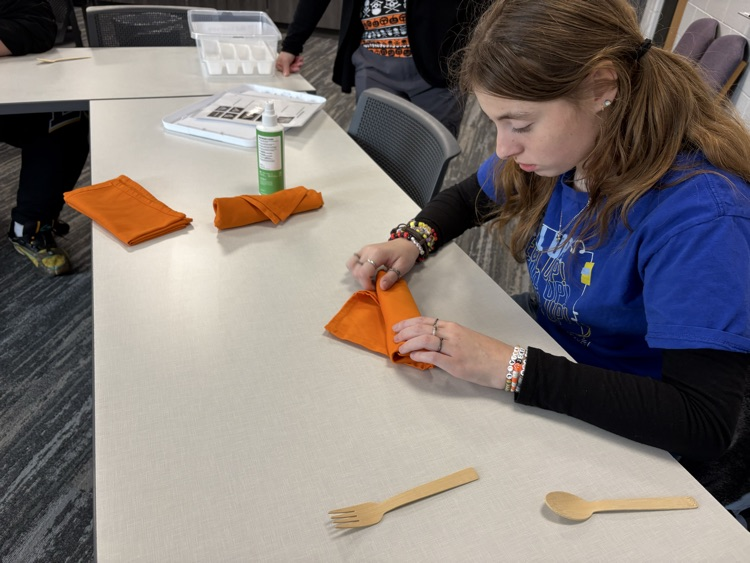Learning how to roll silverware!