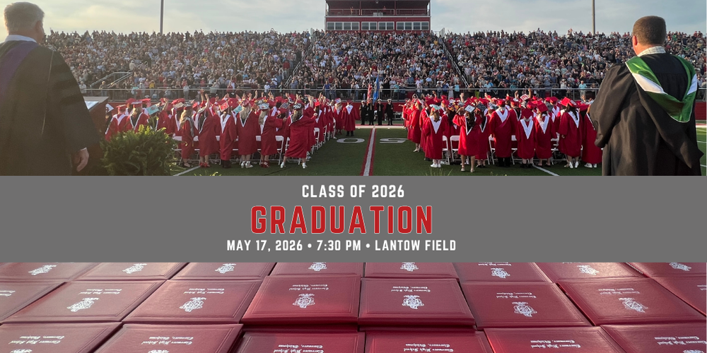 diplomas with graduates in gowns on the field looking at the audience
