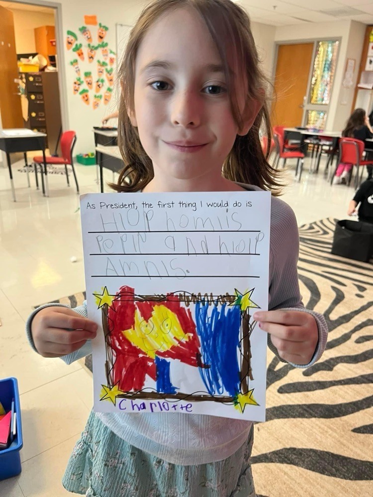 students with their coloring sheets