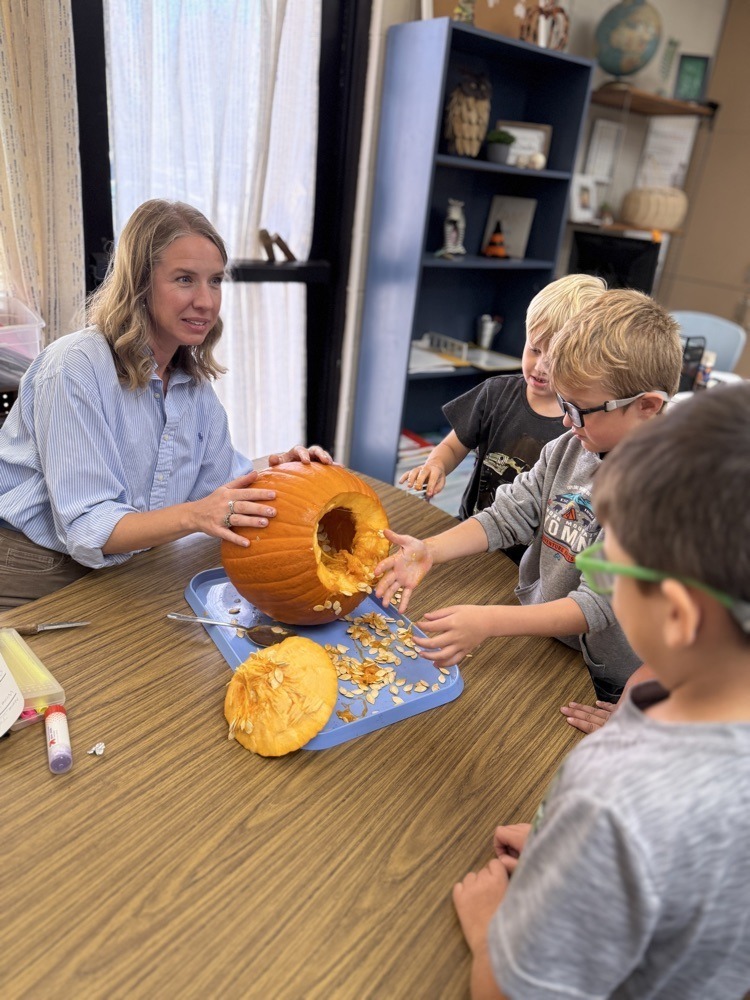 students with pumpkins