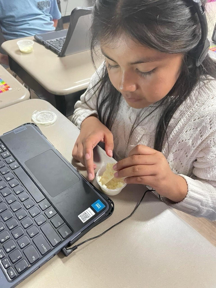 students trying homeade butter