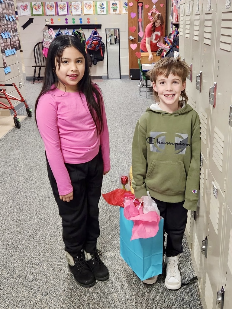 students with gifts for their teacher