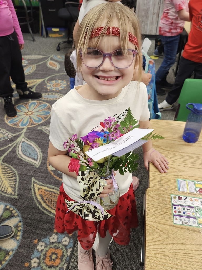 student with flowers she received for valentines day