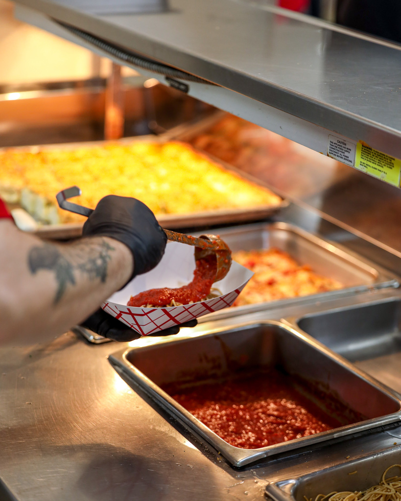 Chef Ryan serving chicken parmesan 