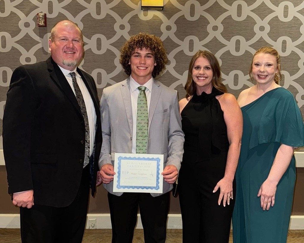 scholarship recipient cooper zickefoose with admin team