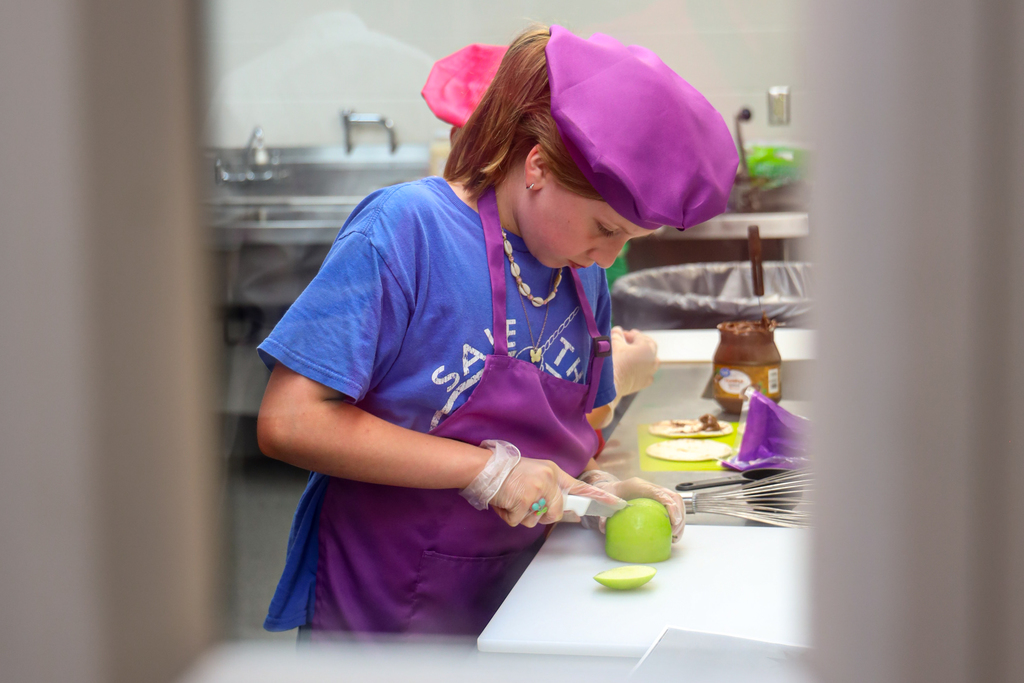 Junior Chef winner working on her dish