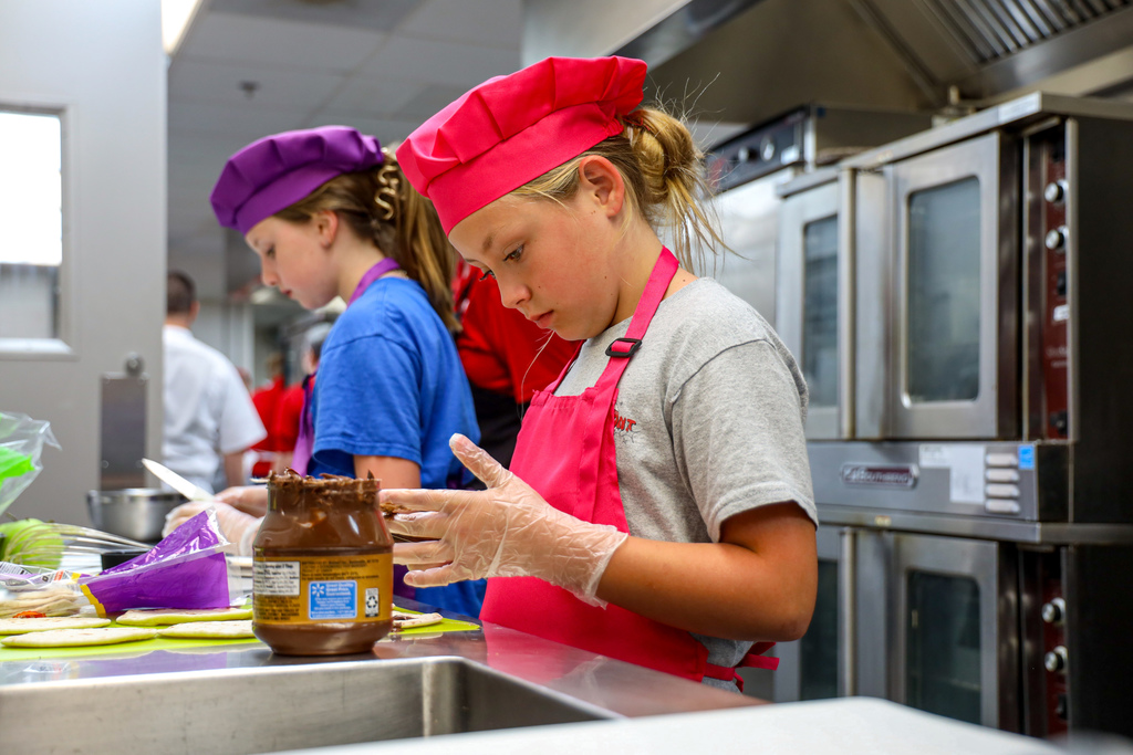 Junior Chef working on her dish