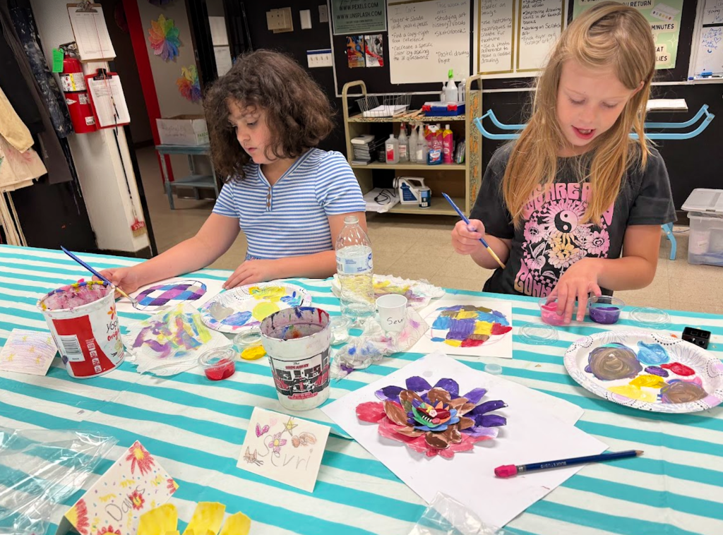 Art camp students work on art projects