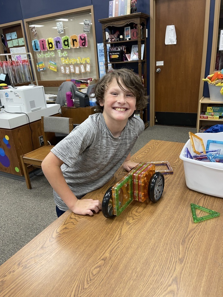 Claremont students playing with S.T.E.M bins at the library.