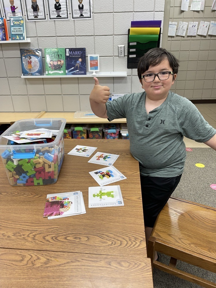 Claremont students playing with S.T.E.M bins at the library.
